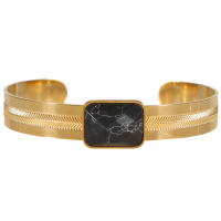 Bracelet jonc rigide en acier doré surmonté d'une pierre de couleur noire.