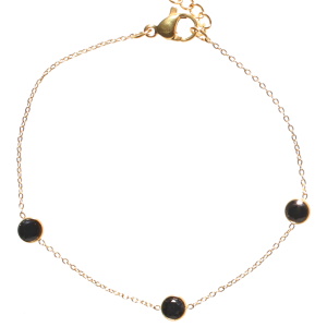 Bracelet composé d'une chaîne en acier doré et de trois oxydes de zirconium noirs sertis clos. Fermoir mousqueton avec 3 cm de rallonge.