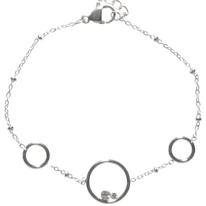 Bracelet composé d'une chaîne avec trois cercles en acier argenté et de deux cristaux sertis clos. Fermoir mousqueton avec 3 cm de rallonge.