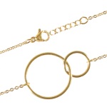 Bracelet avec double cercles en acier doré.