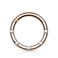 Piercing anneau en acier chirurgical 316L rosé serti de 5 cristaux.