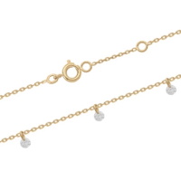 Bracelet composé d'une chaîne en plaqué or jaune 18 carats et de pampilles en oxydes de zirconium blancs. Fermoir anneau de ressort avec anneaux de rappel à 16 et 18 cm.