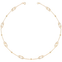 Collier composé d'une chaîne avec boules et motifs filigranes en plaqué or jaune 18 carats.