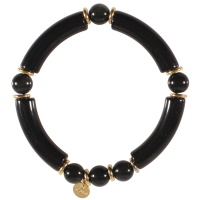 Bracelet élastique composé de perles cylindriques en acier doré, tubes en matière synthétique de couleur noire et des perles de couleur noire.