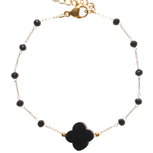 Bracelet composé d'une chaîne en acier doré, de perles et d'une pierre de couleur noire. Fermoir mousqueton avec 3 cm de rallonge.