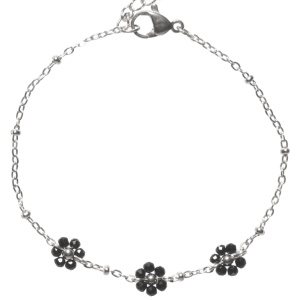 Bracelet composé d'une chaîne en acier argenté avec trois fleurs en perles de couleur noire. Fermoir mousqueton avec 3 cm de rallonge.