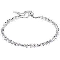 Bracelet ajustable en acier inoxydable 316L argenté et serti 4 griffes d'oxydes de zirconium blancs.