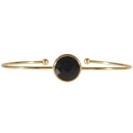 Bracelet jonc ouvert en acier doré et solitaire rond en pierre synthétique de couleur noire.