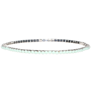 Bracelet fantaisie élastique en métal argenté avec strass de couleur vert serti griffes.