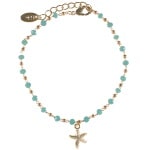 Bracelet avec étoile de mer en acier doré et perles de couleur turquoise. Fermoir mousqueton avec rallonge de 3 cm.