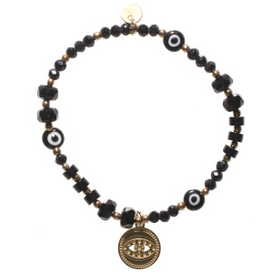 Bracelet élastique composé de perles en acier doré, de perles de couleur noire, de trois perles avec œil de Turquie et d'une pastille ronde en acier doré représentant un œil de Turquie. 