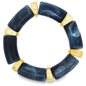 Ce bracelet à perles, ponctué de détails dorés éclatants, offre une esthétique audacieuse et contemporaine. Les perles non métalliques affichent un motif distinctif qui confère à l'ensemble un charme artistique unique. Idéal pour ajouter une touche d'originalité à votre style.