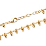Bracelet avec pendants en plaqué or jaune 18 carats.