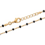 Bracelet en plaqué or 18 carats avec perles en émail de couleur noire.