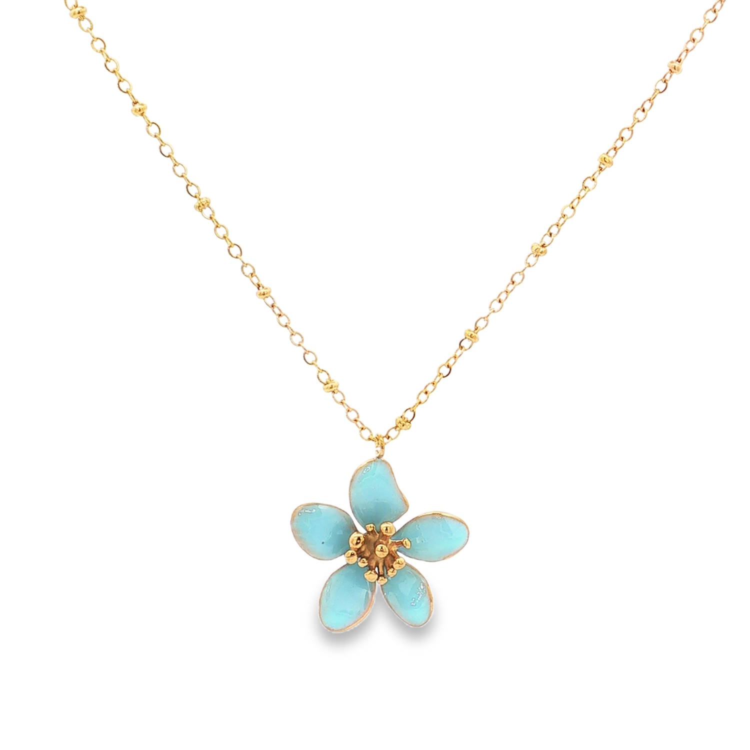 Laissez-vous séduire par ce collier raffiné qui capture l'essence même du printemps et de la légèreté. Alliant la robustesse de l'acier moderne à la délicatesse d'un travail artisanal de l'émail, ce bijou est une véritable ode à la nature et à la féminité.<br/>La pièce maîtresse de ce collier est un pendentif en forme de fleur à cinq pétales, évoquant la simplicité gracieuse d'un myosotis ou d'une fleur de cerisier imaginaire. Chaque pétale est méticuleusement orné d'un émail bleu turquoise vibrant. La finition de l'émail offre un aspect lisse et brillant qui capte la lumière avec douceur, créant des reflets changeants selon vos mouvements.<br/>Au cœur de la fleur, un pistil délicat composé de petites perles d'acier doré apporte un relief subtil et une touche de réalisme précieux.<br/>Un mousqueton sécurisé accompagné d'une chaînette d'extension, permettant d'ajuster parfaitement la taille à votre morphologie. Adolescent Adulte Femme Fille Fleurs Indémodable Nature Laissez-vous séduire par ce collier raffiné qui capture l'essence même du printemps et de la légèreté. Alliant la robustesse de l'acier moderne à la délicatesse d'un travail artisanal de l'émail, ce bijou est une véritable ode à la nature et à la féminité.<br/>La pièce maîtresse de ce collier est un pendentif en forme de fleur à cinq pétales, évoquant la simplicité gracieuse d'un myosotis ou d'une fleur de cerisier imaginaire. Chaque pétale est méticuleusement orné d'un émail bleu turquoise vibrant. La finition de l'émail offre un aspect lisse et brillant qui capte la lumière avec douceur, créant des reflets changeants selon vos mouvements.<br/>Au cœur de la fleur, un pistil délicat composé de petites perles d'acier doré apporte un relief subtil et une touche de réalisme précieux.<br/>Un mousqueton sécurisé accompagné d'une chaînette d'extension, permettant d'ajuster parfaitement la taille à votre morphologie. Adolescent Adulte Femme Fille Fleurs Indémodable Nature
