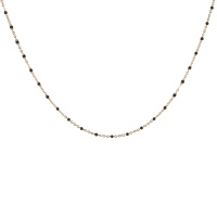 Collier composé d'une chaîne en acier doré et de perles en émail de couleur noire. Fermoir mousqueton avec 5 cm de rallonge.