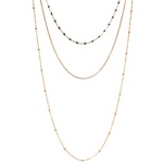 Collier triple rangs composé d'un collier de 38 cm de long  avec perles en émail, un collier de 44 cm de long en acier doré ainsi qu'un collier de 58 cm de long en acier doré. L'ensemble peut se régler jusqu'à 7 cm de plus.