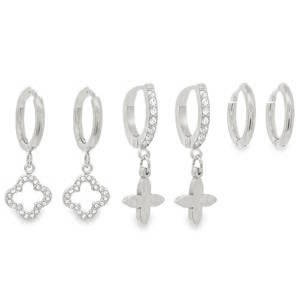 Ce lot de boucles d’oreilles en acier inoxydable argenté est l'ensemble parfait pour celles qui aiment multiplier les piercings avec élégance et cohérence. Conçu pour offrir une variété de styles tout en restant dans une esthétique lumineuse et moderne, ce set se compose de trois paires distinctes. Petites créoles lisses surmontées d'un pendentif en forme de trèfle à quatre feuilles. Créoles dont la face avant est ornée d'une rangée de strass. Elles arborent un pendentif en forme de fleur de lys à la finition polie et lisse, créant un beau contraste avec la brillance des pierres. Petites créoles classiques en acier poli, sans pendentif ni fioriture.