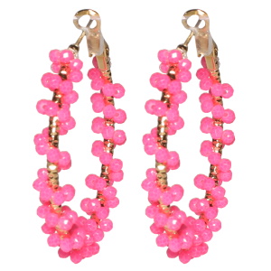 Boucles d'oreilles créoles en acier doré surmontées de perles de couleur rose.