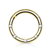 Piercing anneau en acier chirurgical 316L doré serti de 5 cristaux.