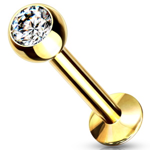 Piercing labret en acier doré chirurgical 316L serti d'un oxyde de zirconium blanc.