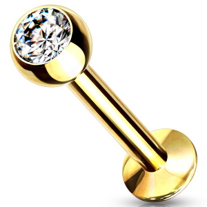 Piercing labret en acier doré chirurgical 316L serti d'un oxyde de zirconium blanc.