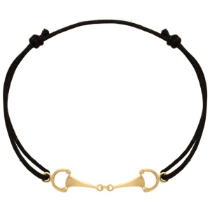 Bracelet composé d'un cordon en coton noir et de mors en plaqué or jaune 18 carats.