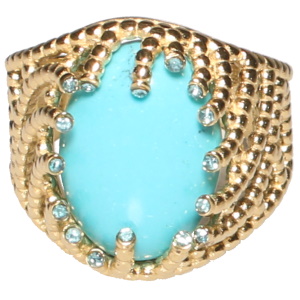 Bague en acier doré avec une pierre de turquoise d'imitation ovale sertie griffes serties de cristaux de couleur bleu. Taille ajustable.