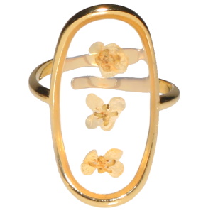Bague de forme ovale en acier doré avec une plaque transparente dessinée de fleurs. Taille ajustable.