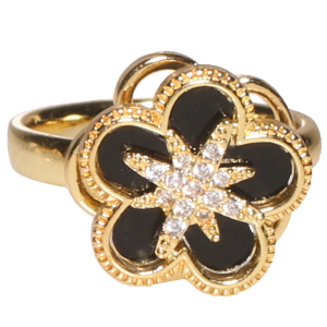 Bague en métal doré surmontée d'une fleur rotative sertie d'un pierre noire et d'une étoile sertie de strass. Bague anti stress avec un objet rotatif pour soulager l'anxiété et le stress. Taille ajustable.