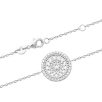 Bracelet surmonté d'un médaillon rond au motif ajouré du soleil en argent 925/000 rhodié et pavé d'oxydes de zirconium. Fermoir mousqueton avec anneaux de rappel à 16 et 18 cm.