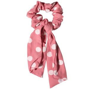 Chouchou élastique pour cheveux sur le modèle d'un ruban en textile de couleur avec des motifs de pois.