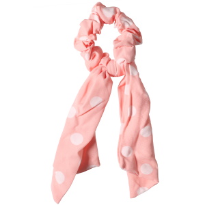 Chouchou élastique pour cheveux sur le modèle d'un ruban en textile de couleur avec des motifs de pois.