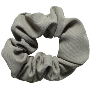 Chouchou élastique pour cheveux en textile de couleur verte.