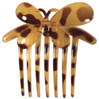 Peigne pour cheveux surmonté d'un papillon en plastique marron tacheté.
