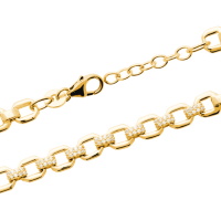 Bracelet composé d'une chaîne en plaqué or jaune 18 carats et de certains maillons pavés d'oxydes de zirconium blancs. Fermoir mousqueton avec 2 cm de rallonge.