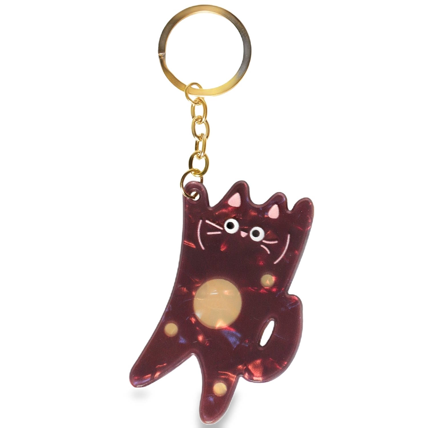 Ce porte-clés allie un style ludique à une esthétique rétro grâce à ses matériaux contrastés.<br/>Le pendentif représente une silhouette de chat stylisée, presque abstraite, rappelant les motifs artistiques modernes.<br/>La structure métallique (anneau et chaîne) est conçue en acier doré.<br/>C'est l'accessoire idéal pour personnaliser un trousseau de clés ou agrémenter la fermeture éclair d'un sac à main. Son look arty-mignon en fait un cadeau parfait pour les amoureux des chats qui recherchent quelque chose d'unique et de stylé. Chat Adolescent Adulte Animaux Enfant Femme Fille Garçon Homme Indémodable Mixte Ce porte-clés allie un style ludique à une esthétique rétro grâce à ses matériaux contrastés.<br/>Le pendentif représente une silhouette de chat stylisée, presque abstraite, rappelant les motifs artistiques modernes.<br/>La structure métallique (anneau et chaîne) est conçue en acier doré.<br/>C'est l'accessoire idéal pour personnaliser un trousseau de clés ou agrémenter la fermeture éclair d'un sac à main. Son look arty-mignon en fait un cadeau parfait pour les amoureux des chats qui recherchent quelque chose d'unique et de stylé. Chat Adolescent Adulte Animaux Enfant Femme Fille Garçon Homme Indémodable Mixte