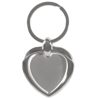 Porte-clés en métal argenté avec cœur amovible.