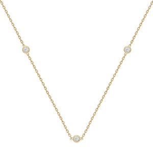 Collier composé d'une chaîne en plaqué or jaune 18 carats et de trois oxydes de zirconium sertis clos. Fermoir anneau ressort avec 3,5 cm.