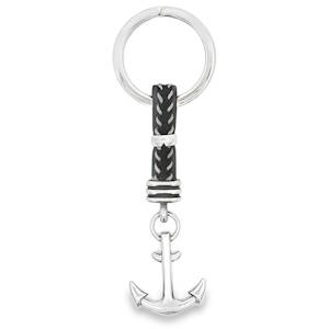 Ce porte-clés élégant présente un design nautique avec un motif d'ancre argentée suspendue à un anneau métallique robuste. La combinaison de matériaux et le thème marin en font un accessoire à la fois fonctionnel et esthétique pour tous les amoureux de la mer.