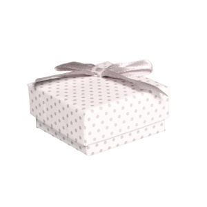 Boîte cadeau écrin pour boucles d'oreilles avec des motifs de pois et avec un nœud papillon.