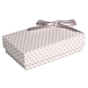 Boîte cadeau écrin pour parure avec des motifs de pois et avec un nœud papillon.